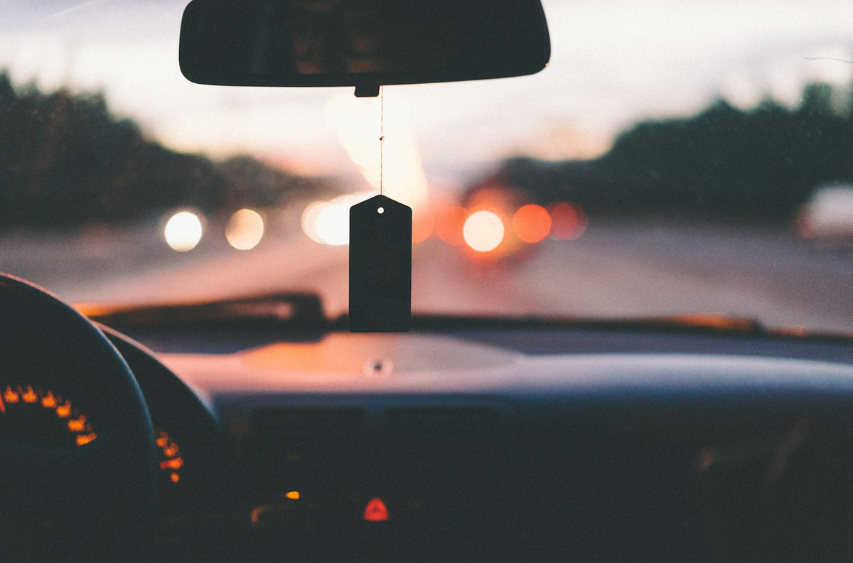 Car dashboard while driving on a highway